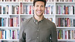 Publishing, happy and face of man with books for career, opportunity and about us at agency. Creative, job and portrait of person by bookshelf for publicist, managing editor and publication house