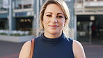 Woman, smile and face in city for travel on business trip for career with real estate investing. Person, realtor or property developer in urban town, confidence and happy with portrait in Germany