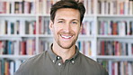 Publishing, smile and face of man with books for career, opportunity and about us at agency. Creative, happy and portrait of person by bookshelf for publicist, managing editor and publication house