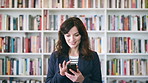 Teacher, education or happy woman with phone in library for academic study, knowledge or information. Female person, professor or scrolling with smile on smartphone for online curriculum or syllabus