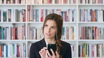 Teacher, thinking or happy woman with phone in library for academic study, knowledge or information. Thoughftul, female person or professor scrolling with smartphone for online curriculum or syllabus