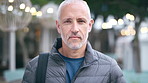 Tourism, city and face of man with bag for commute on holiday, travel and vacation abroad. Happy, town and portrait of mature person with backpack for tourist experience, trip and weekend in London