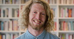 Face, funny and man in library for education, university professor and scholarship for teaching. Portrait, happy person or literature educator with research for English lecture, knowledge and college