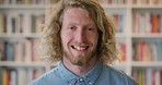 Face, student and man in library with smile, scholarship and research for university assignment. Portrait, male person and learning at campus for knowledge, college education and opportunity to study