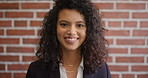 Face, smile and woman on brick wall, business and career development with compliance consultant. Portrait, happy person and employee with ambition, about us and regulatory advisor on background