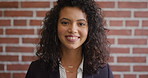 Face, happy and woman on brick wall, business and career development with compliance consultant. Portrait, person and employee with smile for ambition, about us and regulatory advisor on background
