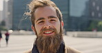 Business, face, and smile with man in city for job opportunity, pride or satisfaction. Buildings, confidence and windy with happy employee outdoor in urban town for career growth or development