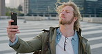 Man, student or city with selfie for photography, travel memory or outdoor capture moment. Male person, user or academic learner with picture for social media post or network connection in urban town