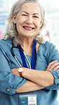 Face, doctor and woman in hospital with arms crossed, medical expertise and healthcare professional. Portrait, mature or specialist with confidence for cardiology knowledge, health service or happy