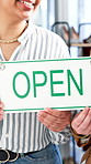Open sign, hands and women entrepreneur by welcome poster to store, business and communication. Fashion, smile or marketing with advertising service on glass, teamwork and support for retail shopping