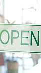 Open sign, hands and woman by welcome poster to store, business and communication for client. Fashion, entrepreneur or marketing with advertising service on glass, support and retail shopping