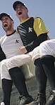 Baseball, team and celebration by dugout with hug, contest win or happy for tournament match success. Low angle, excited men and cheering outdoor for competition, sports winner or embrace for victory