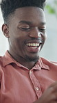 Reading, laugh or black man with phone in home, social media notification or typing message for chat. Happy, online communication or person with mobile for texting, funny forum post or video comments