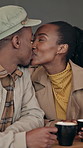 Love, kiss and black couple in coffee shop for date, romantic connection and laughing with happy partner. Cafe, man and woman with affection, funny and healthy relationship for support together