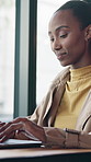 Woman, typing and remote work in cafe with laptop, copywriting proposal or digital marketing campaign. Freelance, copywriter or black person in coffee shop with computer, plan and editing ad project.