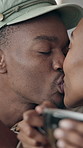 Love, kiss and couple in cafe for date, romantic connection and bonding with happy partner. Coffee shop, black man and woman with affection, healthy relationship and smile for support together
