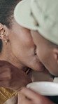 Care, kiss and couple in coffee shop for love, romantic connection or bonding with happy partner. Cafe, man and black woman with affection on date, healthy relationship or smile for support together