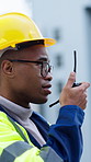 Radio, construction and black man in city for talking, feedback and inspection for building project. Architecture, engineering and person with communication, update or instructions for maintenance