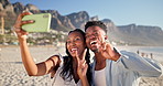 Happy, peace sign and selfie of black couple on beach for picture, social media and online post. Bonding, dating and man with woman with photo, emoji and tongue out on holiday, vacation and weekend