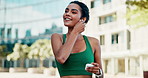Earphones, fitness and woman in city with music, podcast or playlist for runner, exercise or wellness. Audio tech, athlete and female person listening to album or radio for cardio workout in town.