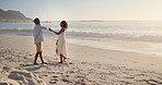 Holding hands, love and couple by beach on holiday, getaway or weekend trip in summer together. Spin, care and man with woman for vacation with support in marriage, romance or anniversary by ocean.