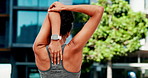 Woman, fitness and stretching with arms for workout preparation or outdoor exercise in city. Back view, female person or getting ready with body warm up for start, begin or training in an urban town