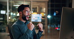 Night, businessman or winning with fist pump in office for promotion or bonus on computer. Excited, man or employee with smile or celebration in evening for business success or good news in workplace