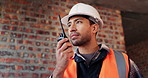 Construction, radio and smile of man on building site for engineering or project management. Communication, listening and talking with happy person on worksite for property development as architect