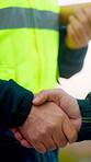 Architect, men and shake hands for partnership in construction with collaboration, greeting or plan. Contractor, civil engineering or people for real estate, project management or onboarding outdoor