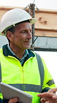 Architect, construction site and man with tablet for planning, discussion or meeting for decision. Mature Inspection, tech and contractor with project management for civil engineering or development