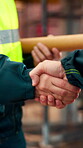 Architect, team and shake hands for construction collaboration for renovation or planning. Contractor, civil engineering or men in partnership for real estate, project management or onboarding
