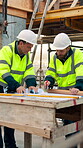 Construction, planning and teamwork with men on building site for project management or review. Documents, floor plan and writing with people outdoor for architecture, design or property development