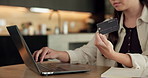 Credit card, laptop and hands of woman in home with online shopping, ecommerce or website for payment. Computer, debit and female person with internet banking for finance transaction in apartment.