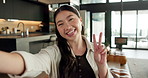 Face, Asian woman and selfie in home, peace sign and social media post for memory with POV. Portrait, photography and person at house with profile picture, v gesture and smile for status update
