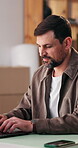 Logistics, man and typing on laptop in startup for order update, courier site review or ecommerce. Small business owner, tech and happy for delivery status, email client invoice and tracking shipment