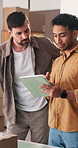Shipping, team and men with tablet in office, discussion and planning for stock distribution on web. Logistics, small business and people with tech for order, supply chain and inventory management