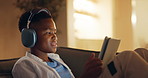 Headphones, tablet and black child in house with video call, communication or waving for online gaming. Relax, talking and boy on sofa for virtual conversation for game on app with digital technology