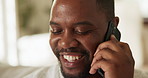 Phone call, laugh and man on sofa for talking, online conversation and chatting for connection. Happy, weekend and person on cellphone for speaking, networking and contact for communication in home