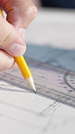 Architecture, ruler and hands of person with layout, design and blueprint for building project. Engineer, contractor and worker with pencil, scale and drawing for floor plan, remodeling or renovation