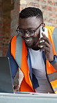 Blueprint, architecture and black man with phone call, laptop and update for building project. Contractor, computer and person on cellphone for discussion, conversation and planning for construction