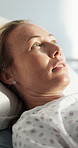 Thinking, recovery and woman on bed in hospital for diagnosis, treatment or surgery rehabilitation. Relax, healthcare and female patient in ward with comfort for medical operation in ICU at clinic.