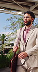 Businessman, walk or commute in city with bag, real estate job or thinking for property investment. Outdoor, person and morning journey in urban town with glasses, work and travel for realtor career.