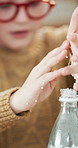 Children, science and learning with experiment for chemistry, research or fun discovery together. Kids, sbilings or students with bottle for chemical reaction, education or childhood development