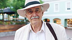 Travel, happy and face of old man in city for explore, peace and heritage specialist. Smile, confidence and culture tour guide with senior person outdoor for traveler, tourism and weekend break