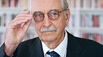 Glasses, professor and face of man in library for about us, course lecturer and faculty manager. Education, university dean and bookshelf with mature person for pride, teacher and college advisor