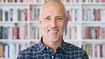 Happy, professor and face of man in library for about us, course lecturer and faculty manager. Education, university and bookshelf with mature person on campus for pride, teacher and college advisor