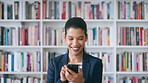 Secretary, laughing or happy woman with phone in library for academic administration or information. Female person, administrator or scrolling with smile or books on smartphone for online assistance