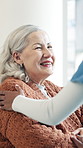 Conversation, nurse and senior woman in house with comfort, consultation or medical support. Happy, healthcare and caregiver with elderly female person in retirement for checkup in nursing home.