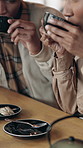 Morning, drink and black couple in coffee shop for dating, relationship and bonding in cafe. Happy, restaurant and man with woman with cup, beverage and together for break, love and connection