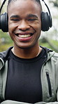 Headphones, face and black man with arms crossed for fitness, morning cardio and music playlist. Relax, athlete and happy outdoor for wellness practice, health confidence and streaming audio album